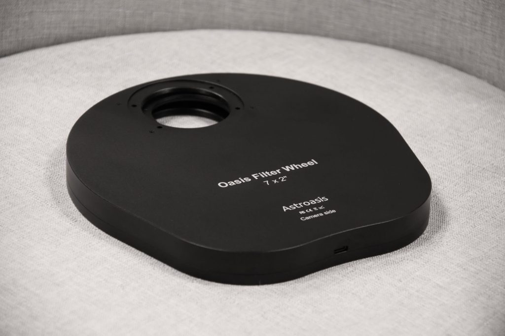 astroasis oasis 7x2 filter wheel sitting on a chair