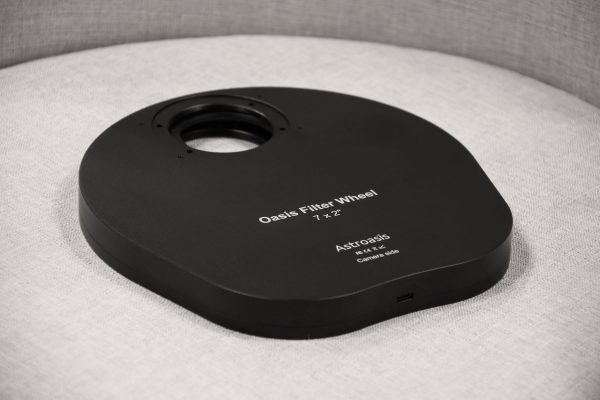 astroasis oasis 7x2 filter wheel sitting on a chair